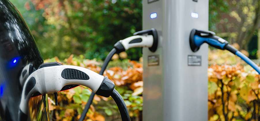 Reducing grid extension costs through smart EV charging